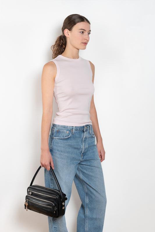 The Esme Tank by Flore Flore is a fitted crew neck tank top with a double stitched cut-off seam on the back.