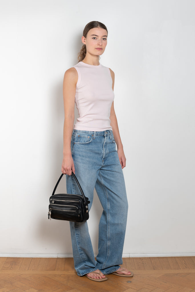 The Esme Tank by Flore Flore is a fitted crew neck tank top with a double stitched cut-off seam on the back.