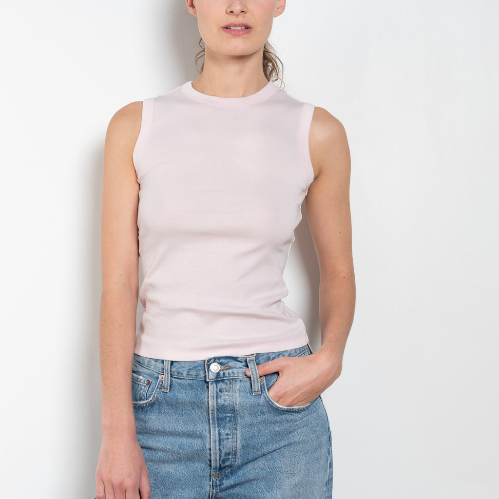 The Esme Tank by Flore Flore is a fitted crew neck tank top with a double stitched cut-off seam on the back.