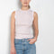 The Esme Tank by Flore Flore is a fitted crew neck tank top with a double stitched cut-off seam on the back.