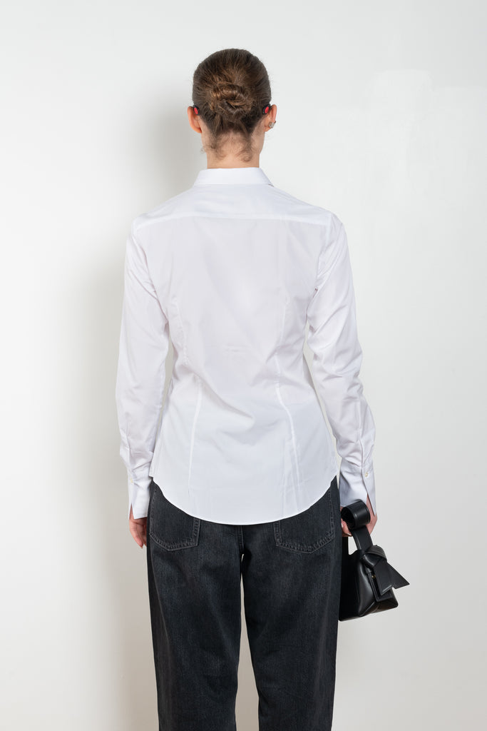 The Giulia Shirt by Flore Flore is a slim fitted shirt with a pointy collar and lengthened single buttoned cuffs with two pleats on the back