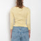 The Steffi Tee by Flore Flore is a classic boat neck tee with a 3/4 sleeve with a double stitched cut-off seam on the back
