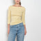 The Steffi Tee by Flore Flore is a classic boat neck tee with a 3/4 sleeve with a double stitched cut-off seam on the back