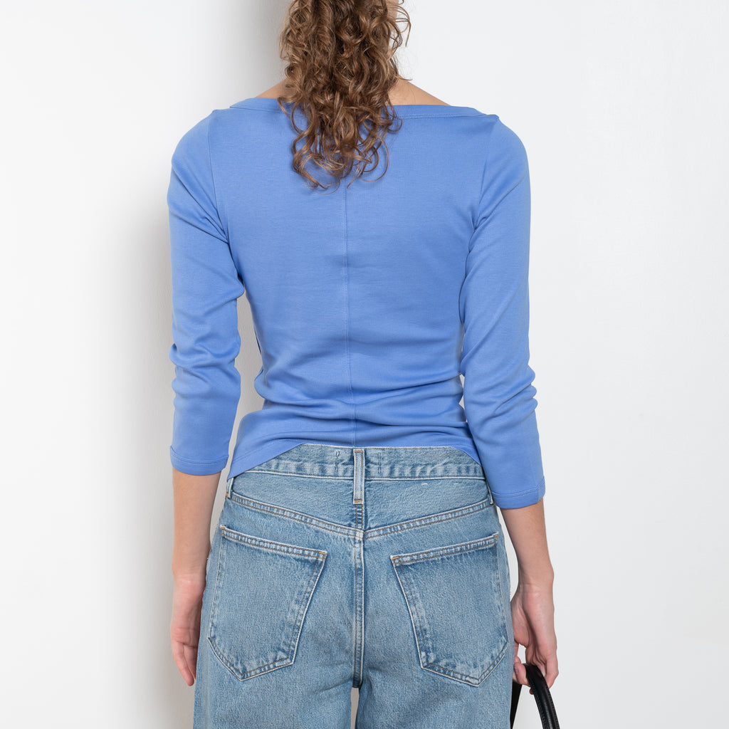 The Steffi Tee by Flore Flore is a classic boat neck tee with a 3/4 sleeve with a double stitched cut-off seam on the back