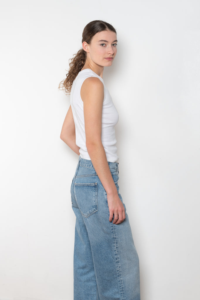The Esme Tank by Flore Flore is a fitted crew neck tank top with a double stitched cut-off seam on the back.