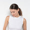 The Esme Tank by Flore Flore is a fitted crew neck tank top with a double stitched cut-off seam on the back.