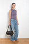 The Esme Tank by Flore Flore is a fitted crew neck tank top with a double stitched cut-off seam on the back