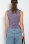 The Esme Tank by Flore Flore is a fitted crew neck tank top with a double stitched cut-off seam on the back
