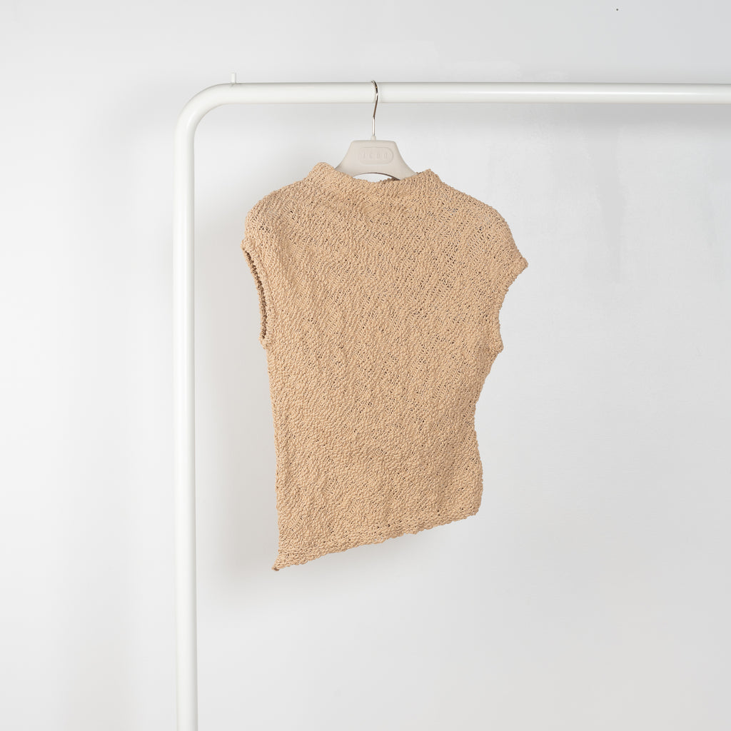 The Top 2772 by Gauchere is an assymetric top in a beige cotton knit