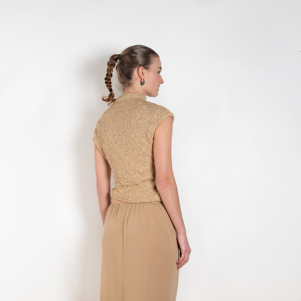 The Top 2772 by Gauchere is an assymetric top in a beige cotton knit