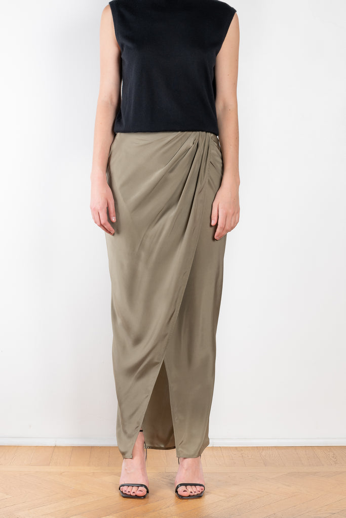 The Paita Long Skirt by Gauge81 is a maxi length wrap skirt with a zip closure in silk