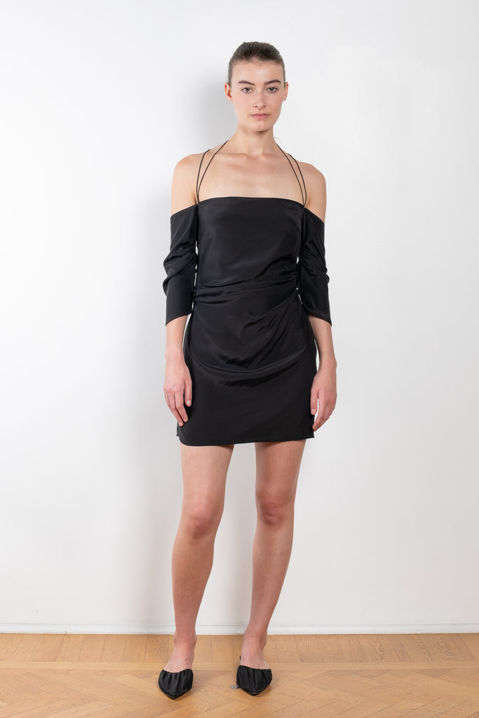 The Samaca Mini Dress by GAUGE81 is a silk off-the-shoulder dress with fine straps both as a halter & crossed back