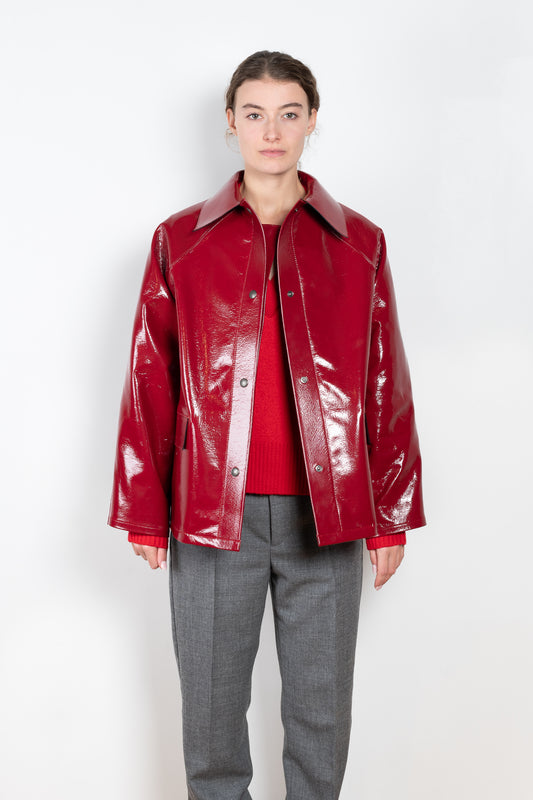 The Original Hip Lacquer Jacket by Kassl Editions is crafted from bold and striking red lacquer wool in a vibrant red color