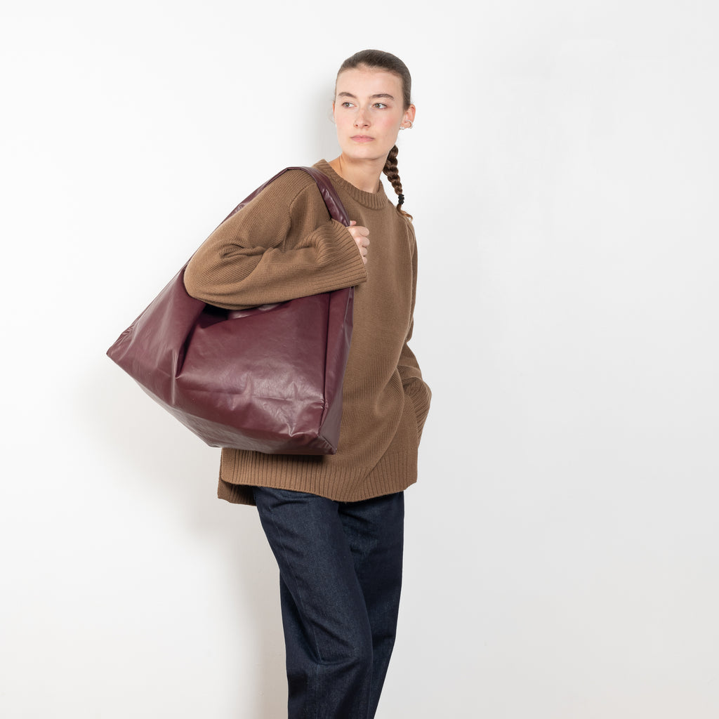 The Tote Shoulder Oil by Kassl Editions is crafted from the signature oil coated cotton-blend