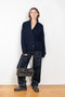 The Annalike Cardigan Jacket by Lisa Yang is a cardigan vest in a fisherman ribbed cashmere with a shawl-neck collar