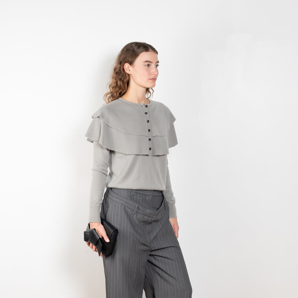 The Aubrey Sweater by Lisa Yang is a feminine cardigan top with a big ruffle detail collar