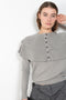 The Aubrey Sweater by Lisa Yang is a feminine cardigan top with a big ruffle detail collar