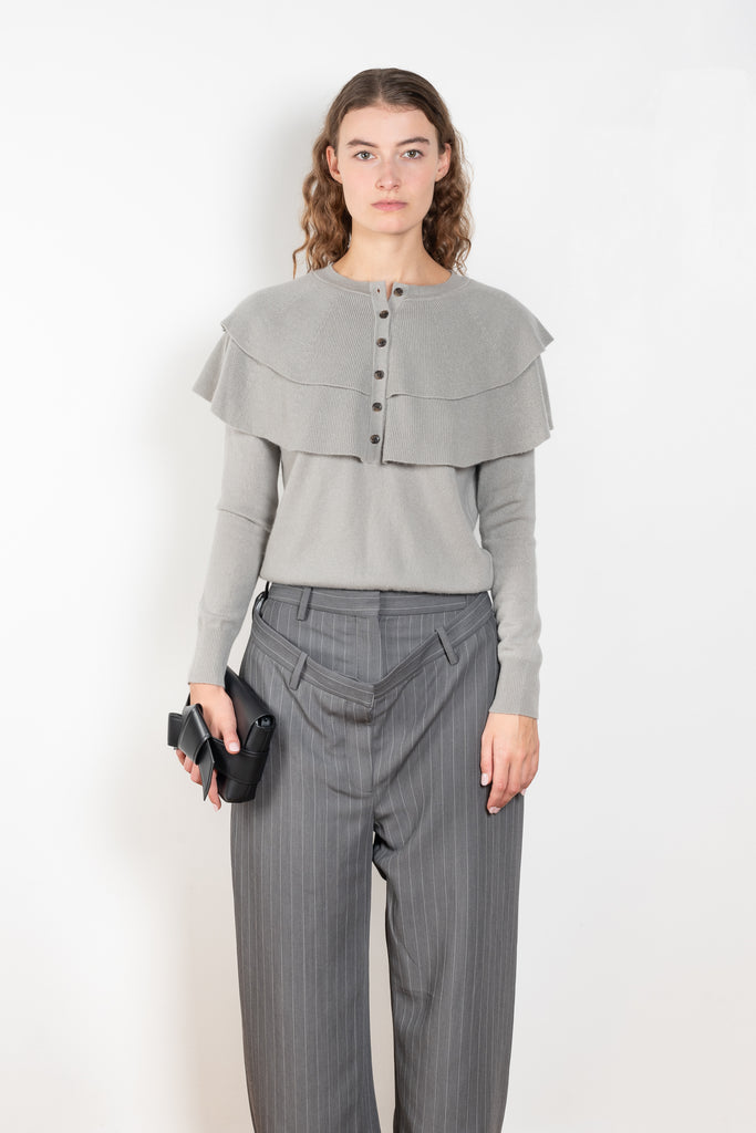 The Aubrey Sweater by Lisa Yang is a feminine cardigan top with a big ruffle detail collar