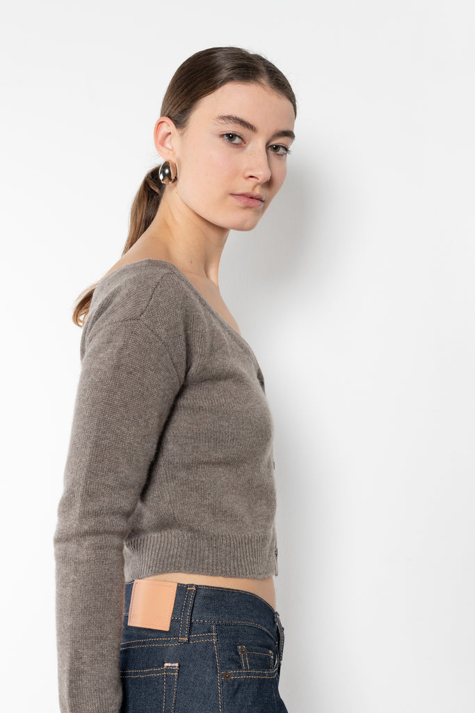 The Beata cardigan by LISA YANG is an off-the-shoulder cashmere cardigan with a cropped fitted silhouette