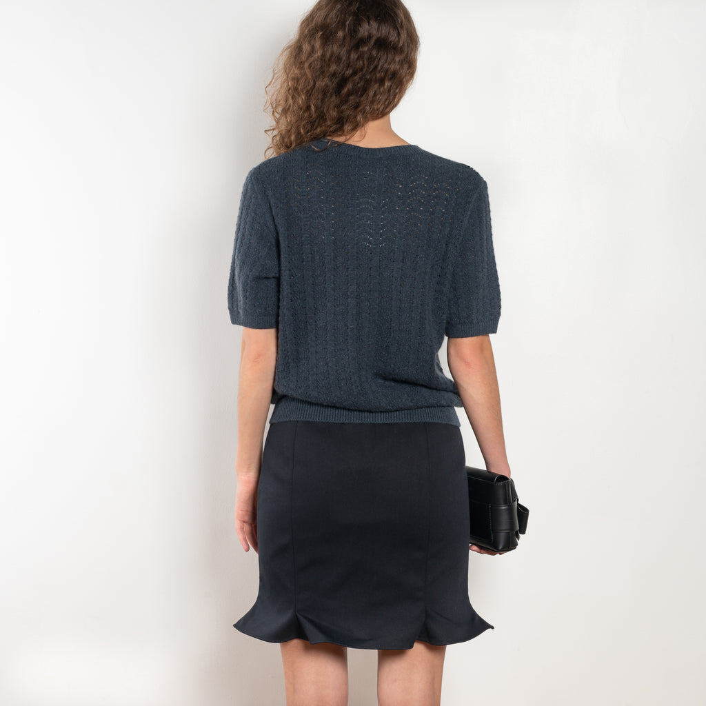 The Cecelia Pointelle Sweater by Lisa Yang is a fine knit cashmere top with a round neck and pointelle detailing