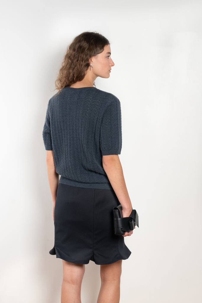 The Cecelia Pointelle Sweater by Lisa Yang is a fine knit cashmere top with a round neck and pointelle detailing