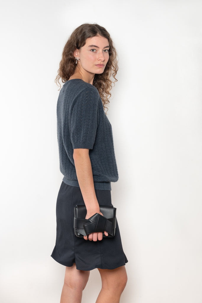 The Cecelia Pointelle Sweater by Lisa Yang is a fine knit cashmere top with a round neck and pointelle detailing