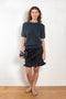 The Cecelia Pointelle Sweater by Lisa Yang is a fine knit cashmere top with a round neck and pointelle detailing