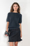 The Cecelia Pointelle Sweater by Lisa Yang is a fine knit cashmere top with a round neck and pointelle detailing