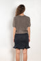 The Cecelia Pointelle Sweater by Lisa Yang is a fine knit cashmere top with a round neck and pointelle detailing
