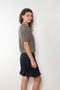 The Cecelia Pointelle Sweater by Lisa Yang is a fine knit cashmere top with a round neck and pointelle detailing
