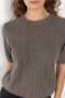 The Cecelia Pointelle Sweater by Lisa Yang is a fine knit cashmere top with a round neck and pointelle detailing
