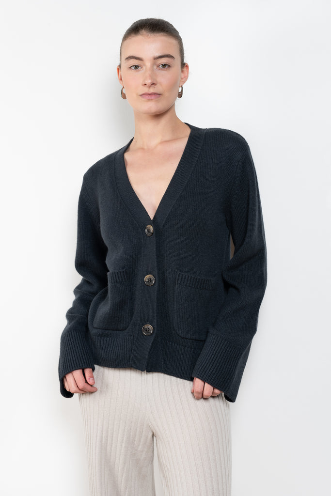 The Danni Cardigan by LISA YANG has extended sleeves for a feminine look, accentuated by patch pockets, ribbed trims and dropped shoulders