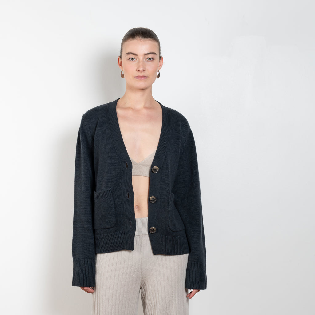 The Danni Cardigan by LISA YANG has extended sleeves for a feminine look, accentuated by patch pockets, ribbed trims and dropped shoulders