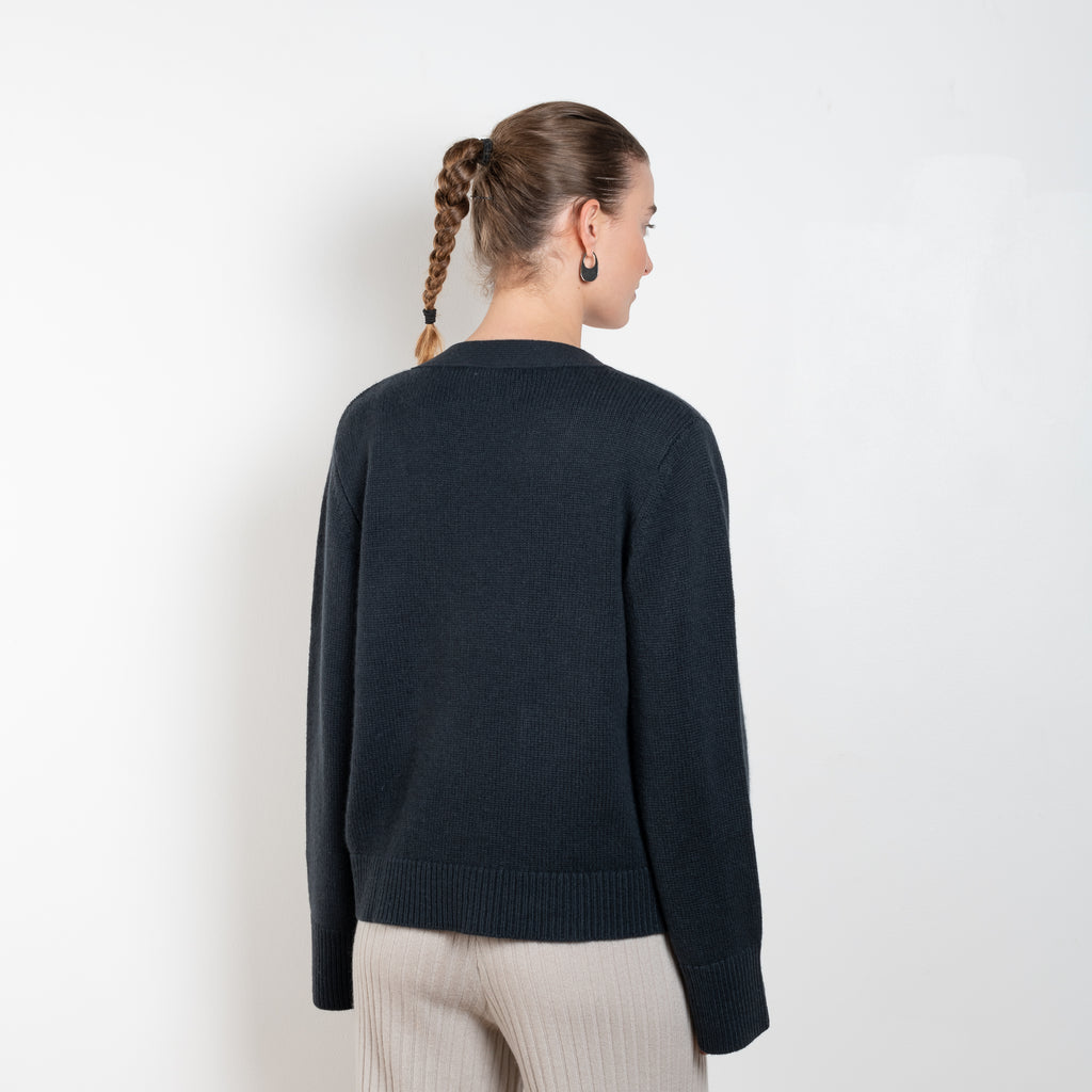 The Danni Cardigan by LISA YANG has extended sleeves for a feminine look, accentuated by patch pockets, ribbed trims and dropped shoulders