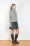 The Fleur Sweater by Lisa Yang has a relaxed silhouette with a loose high neck