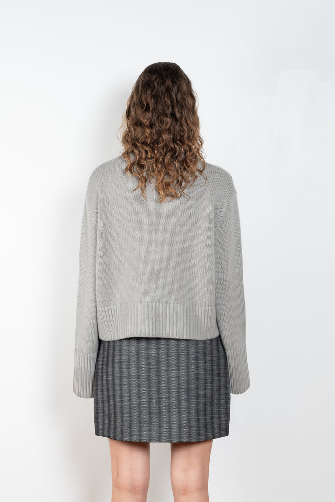 The Fleur Sweater by Lisa Yang has a relaxed silhouette with a loose high neck