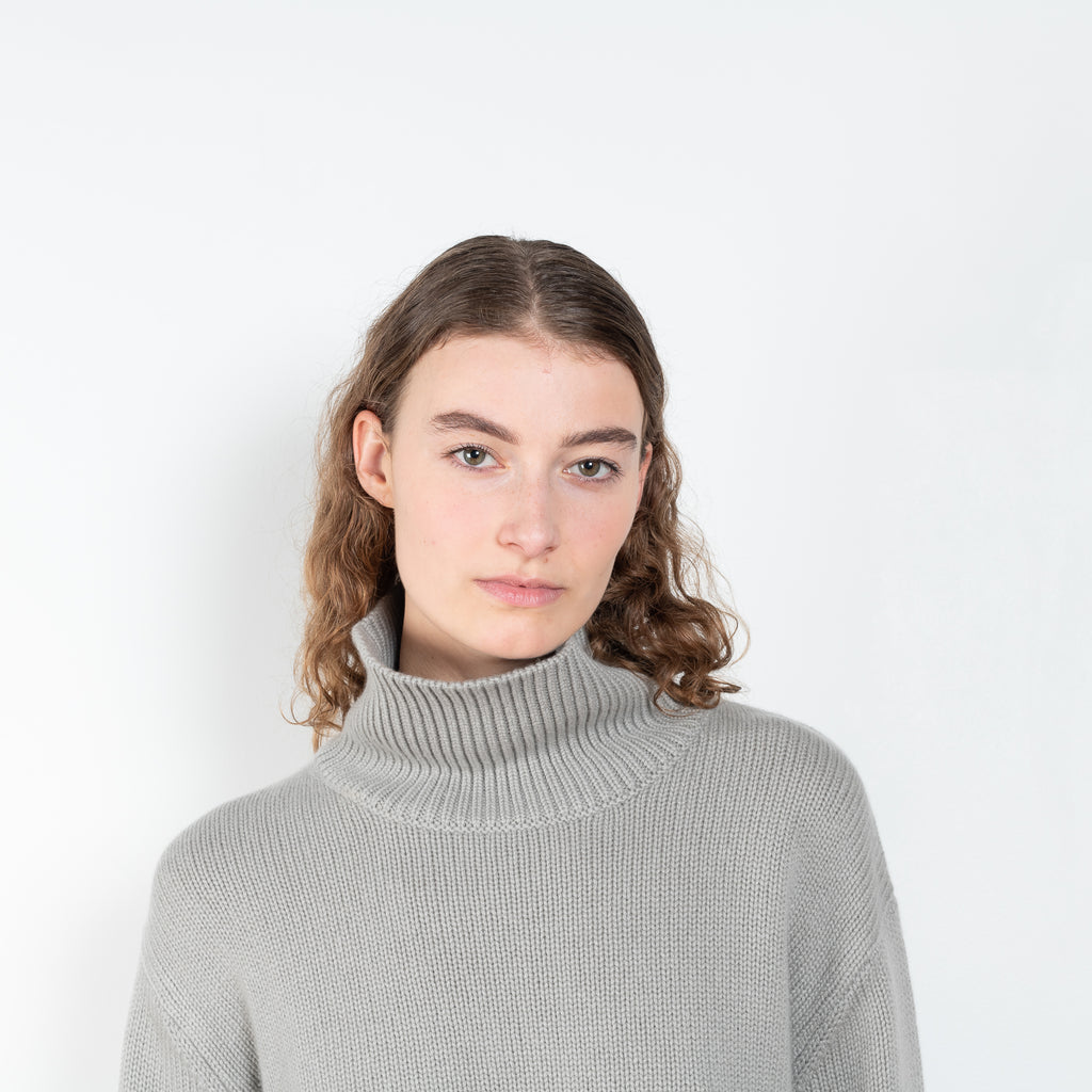 The Fleur Sweater by Lisa Yang has a relaxed silhouette with a loose high neck