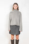 The Fleur Sweater by Lisa Yang has a relaxed silhouette with a loose high neck