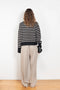 The Fleur Sweater by Lisa Yang has a relaxed silhouette with a loose high neck