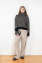 The Fleur Sweater by Lisa Yang has a relaxed silhouette with a loose high neck