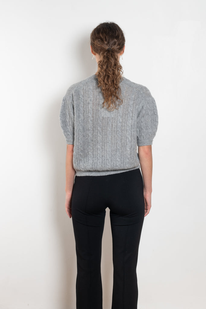 The Kenzie Sweater Sweater by Lisa Yang is a softly voluminous cable knit top in a delicate silk cashmere blend.