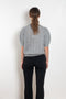 The Kenzie Sweater Sweater by Lisa Yang is a softly voluminous cable knit top in a delicate silk cashmere blend.