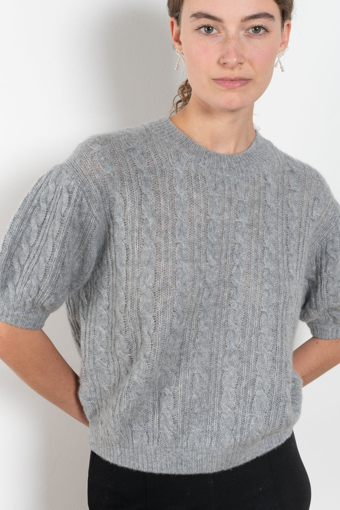The Kenzie Sweater Sweater by Lisa Yang is a softly voluminous cable knit top in a delicate silk cashmere blend.