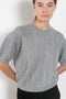 The Kenzie Sweater Sweater by Lisa Yang is a softly voluminous cable knit top in a delicate silk cashmere blend.