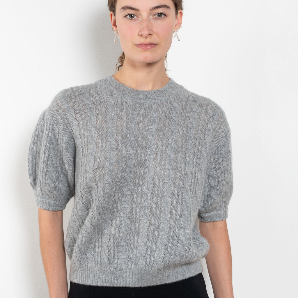 The Kenzie Sweater Sweater by Lisa Yang is a softly voluminous cable knit top in a delicate silk cashmere blend.
