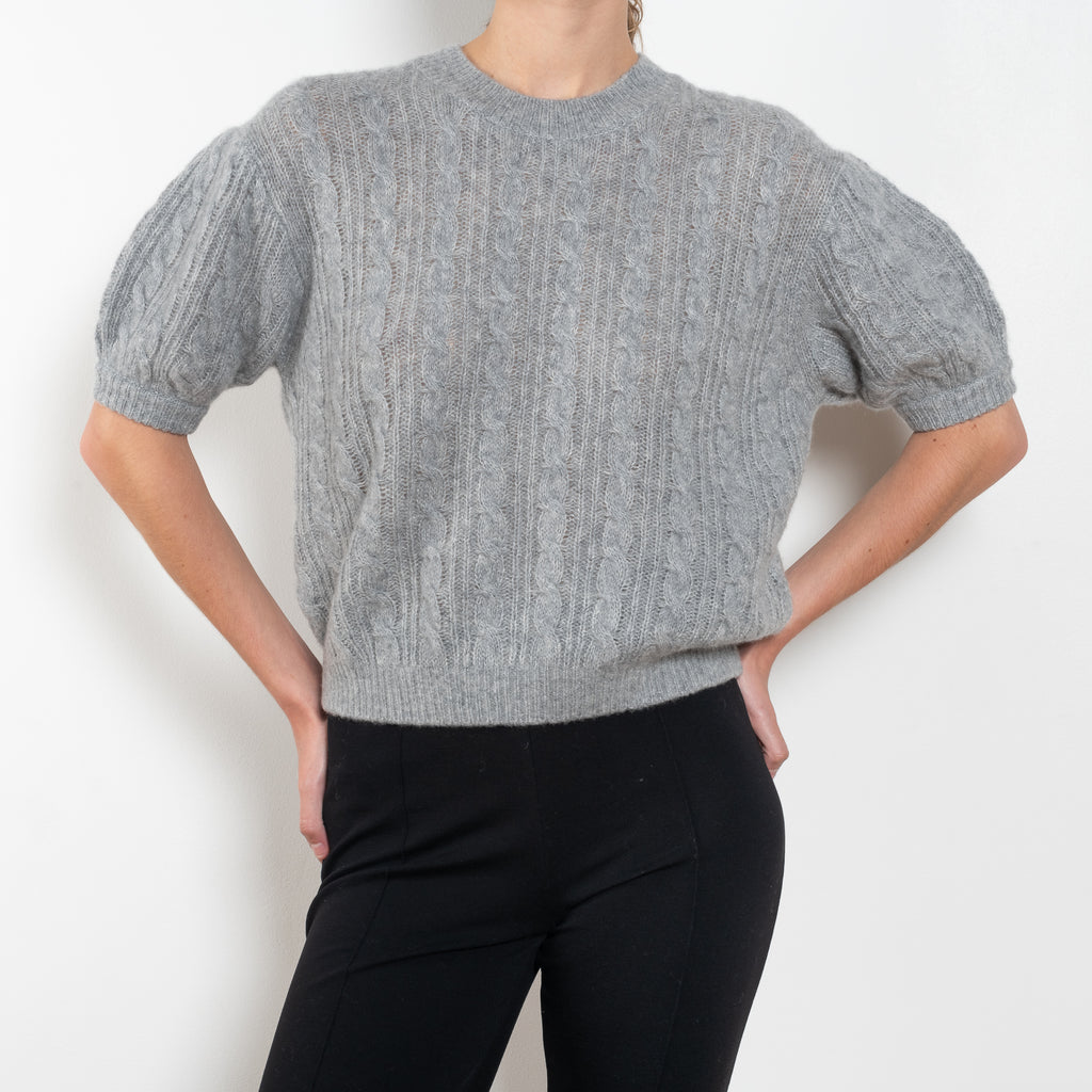 The Kenzie Sweater Sweater by Lisa Yang is a softly voluminous cable knit top in a delicate silk cashmere blend.