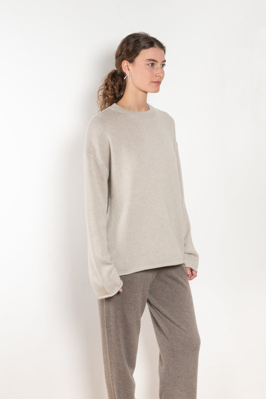 The Kristy Sweater by Lisa Yang is a 5 gauge cashmere relaxed knit with a longline silhouette and crewneck crafted in a heavy knit cashmere with a textured hand feel