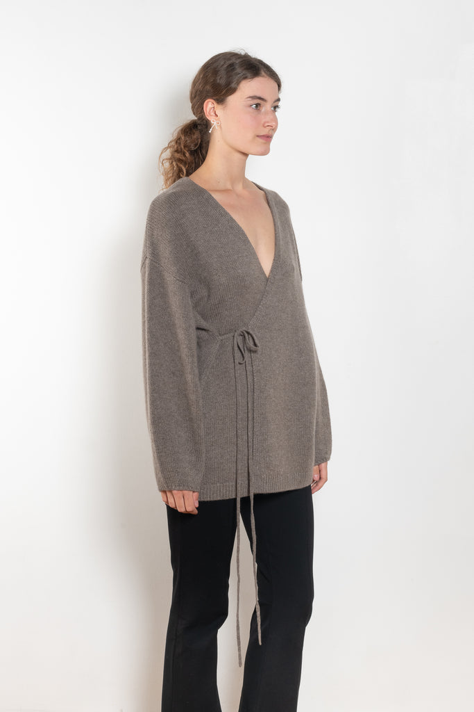 The Laurina Wrap Cardigan is a refined and feminine cashmere knit wrap cardigan with a tied waist