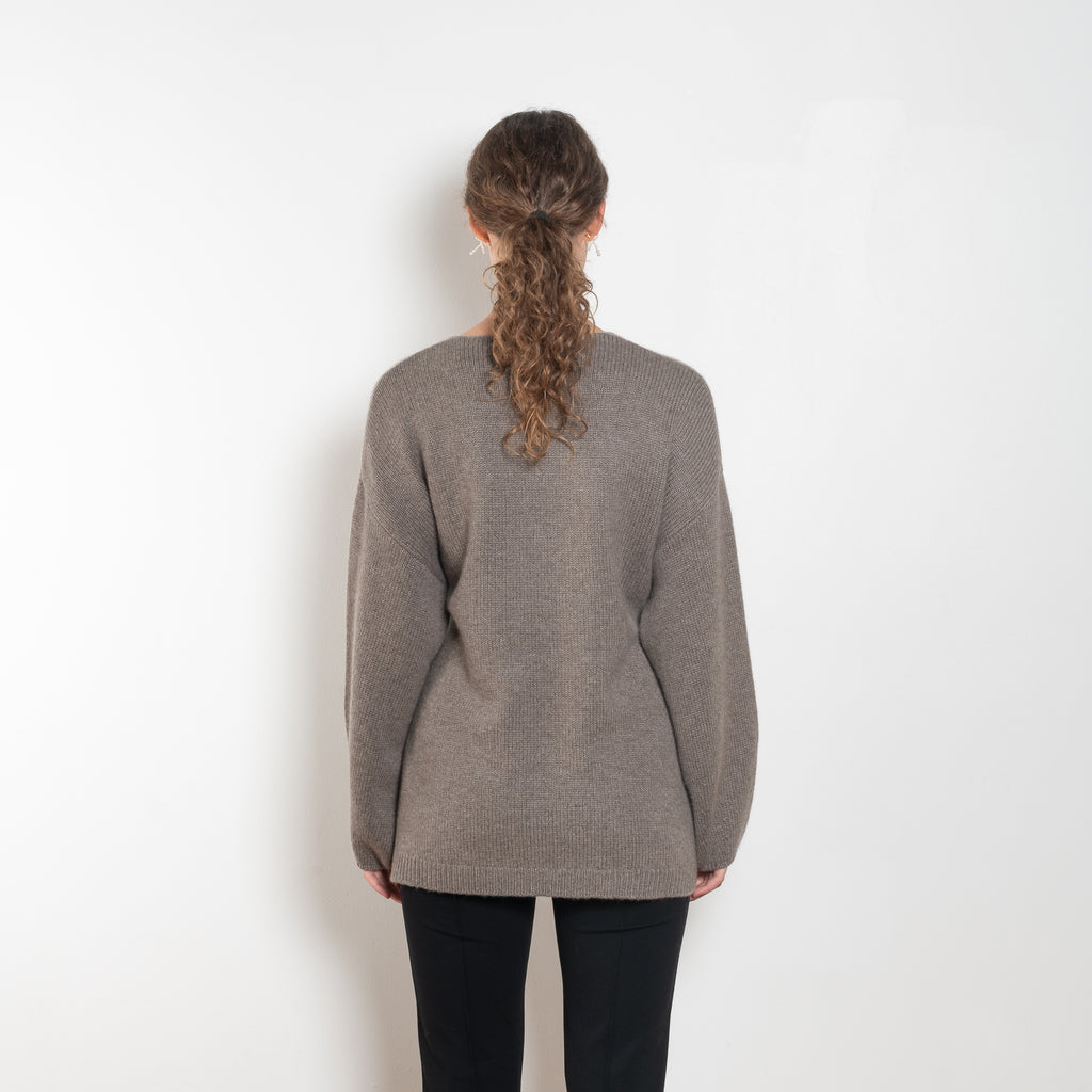 The Laurina Wrap Cardigan is a refined and feminine cashmere knit wrap cardigan with a tied waist