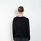 The Leona Sweater by Lisa Yang is a V-neck sweater with dropped shoulders in a textured cashmere silk